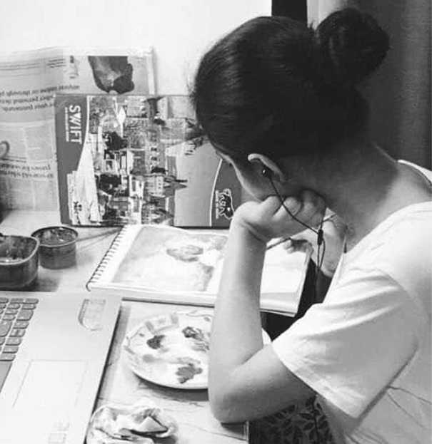 arunima as a teenager, painting at a desk
